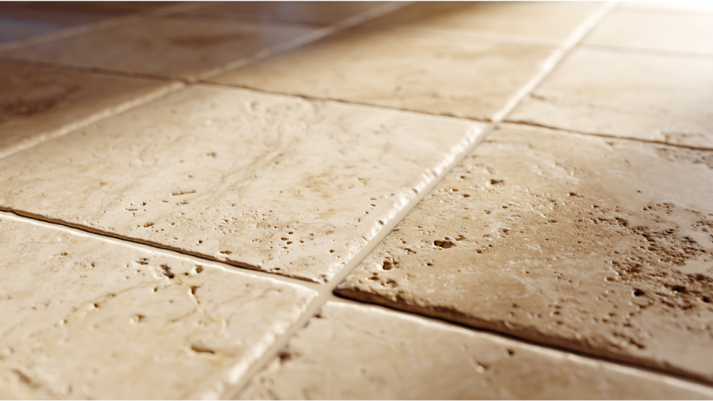 Detailed close-up of textured beige travertine floor tiles showing natural pits and swirls.