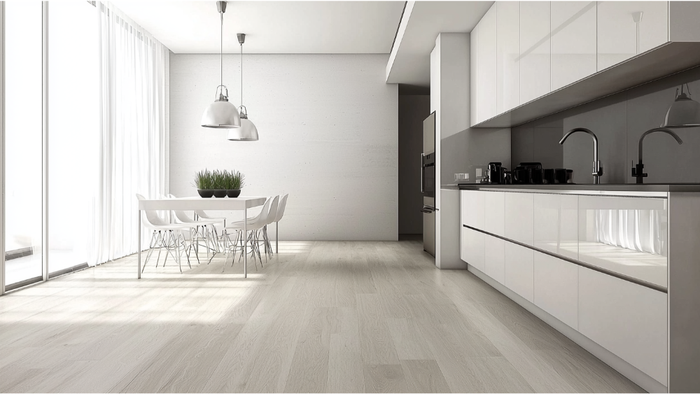 Minimalist kitchen with white cabinetry and pale blonde vinyl plank flooring.